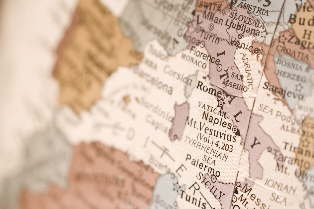 Close up shot of Rome, Italy on an English globe.