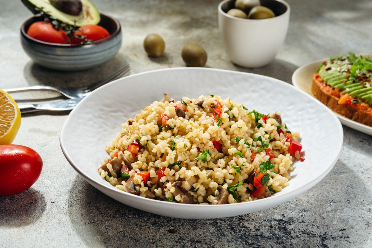 vegetarian and vegan dish bulgur tabbouleh with pepper and herbs